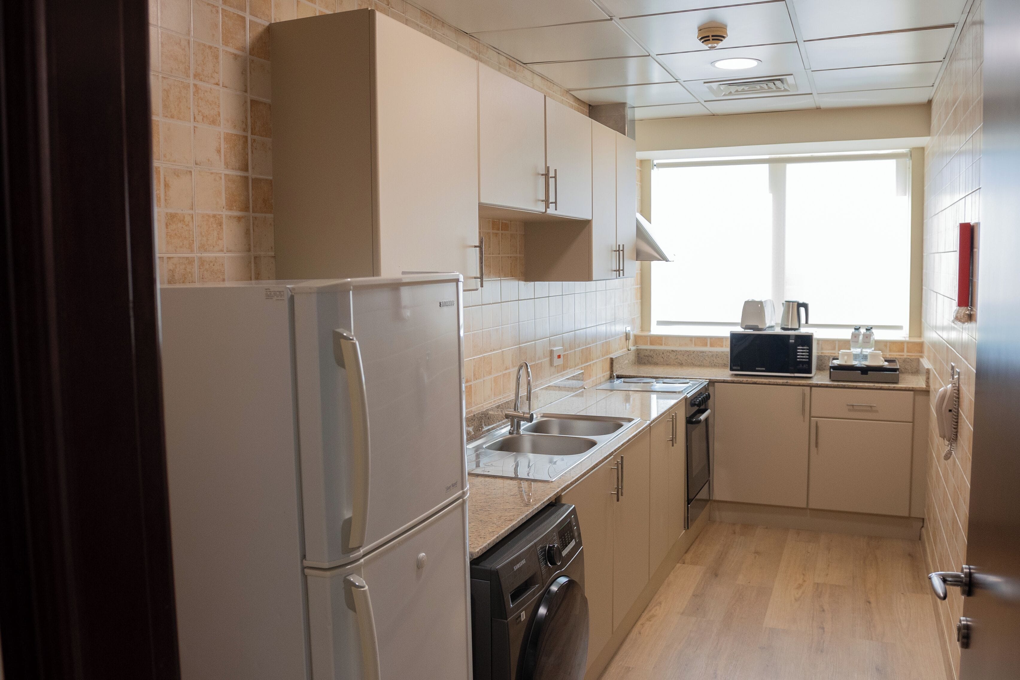 family suite, multiple beds | private kitchen | eco-friendly cleaning products, freezer