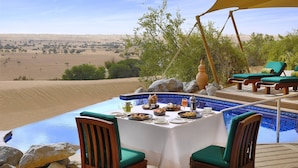 A dining area with a pool overlooking a desert landscape. - Al Maha, A Luxury Collection Desert Resort & Spa, Dubai (Murqquab)