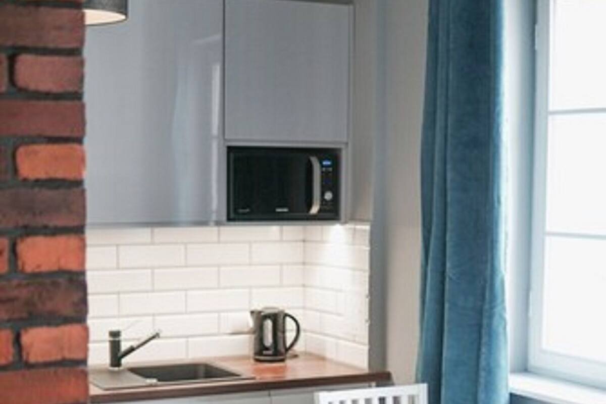 Classic Studio Suite | Living area | 40-inch LCD TV with satellite channels, TV