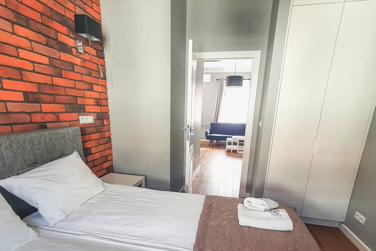 Economy Suite | Premium bedding, blackout curtains, iron/ironing board, free WiFi