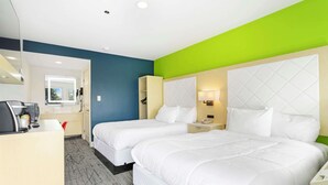 A hotel room with two beds, a desk, a chair, a mirror, and a window. - Signature Inn Berkeley (Berkeley)