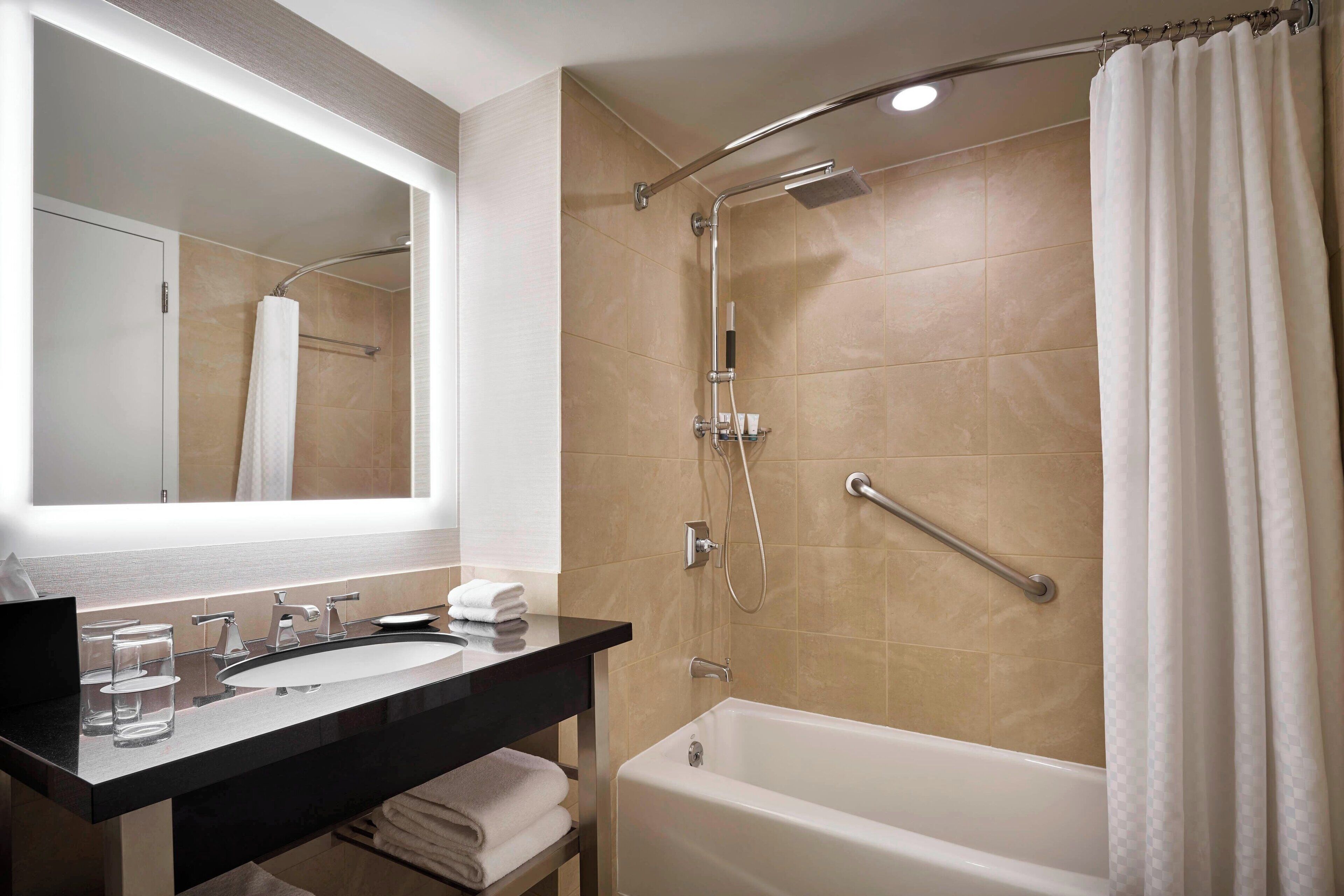 combined shower/bathtub, rainfall showerhead, designer toiletries