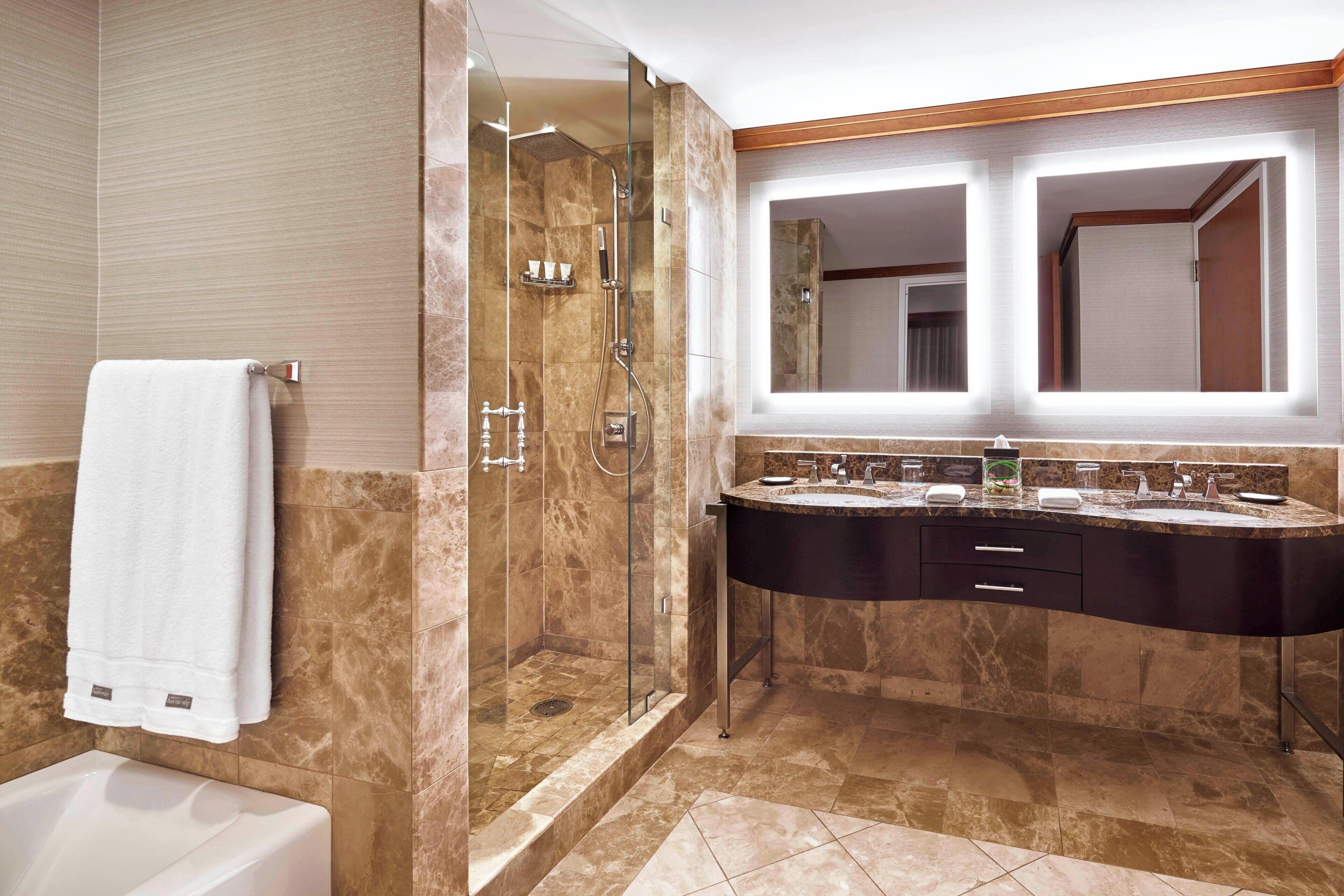 presidential suite, 1 king bed, non smoking | bathroom | combined shower/bathtub, rainfall showerhead, designer toiletries