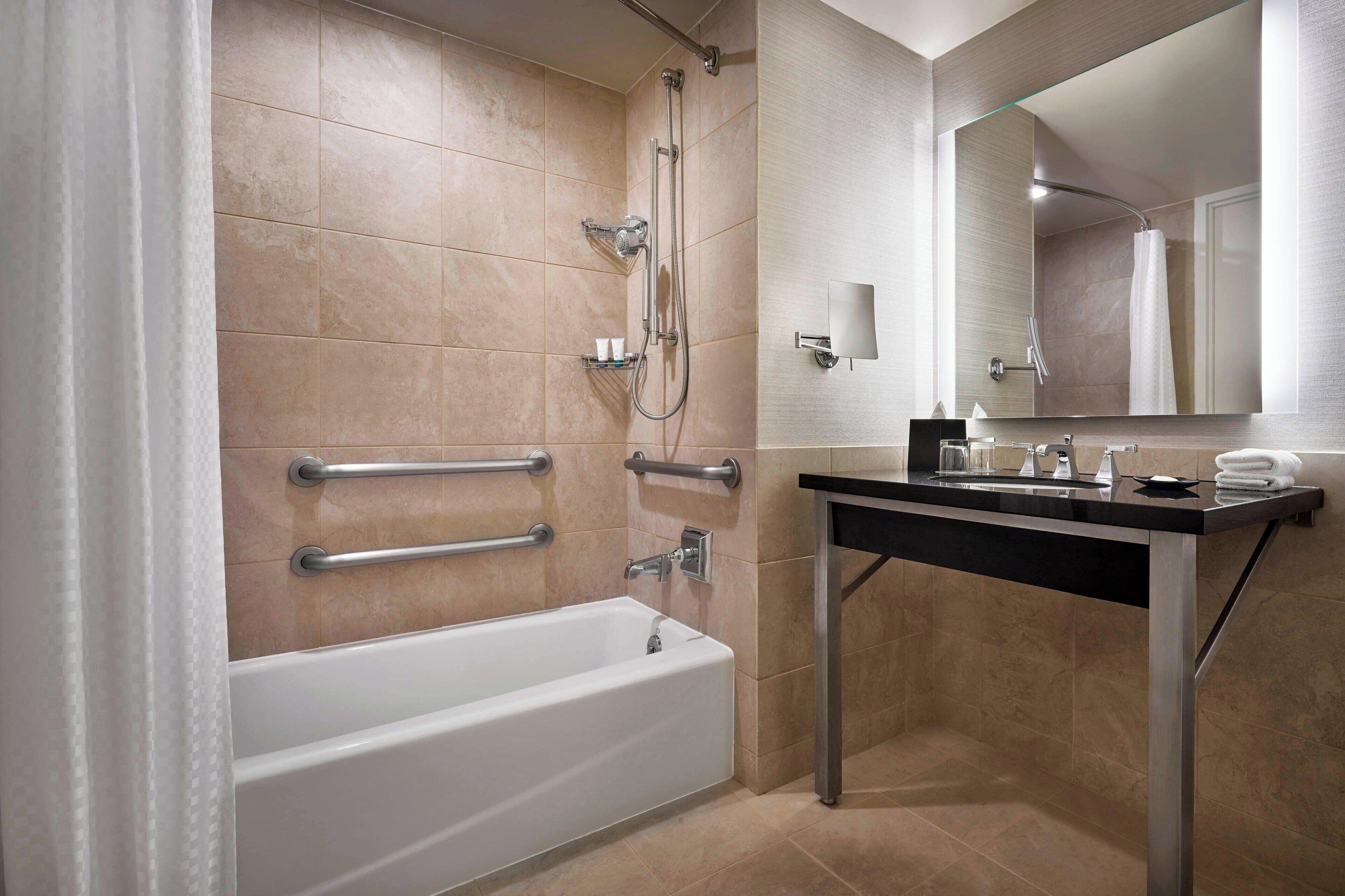 combined shower/bathtub, rainfall showerhead, designer toiletries