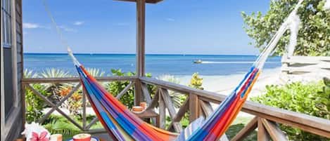 Superior Bungalow, Balcony, Beachfront | Minibar, desk, blackout drapes, free WiFi