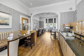 Guests can dine at a communal table or relax in a separate seating area.