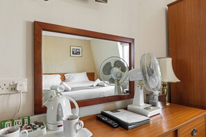Relax in comfort with a desk, fan, and wardrobe, plus a kettle for your convenience.