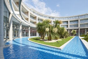 Indoor pool, seasonal outdoor pool, pool umbrellas, sun loungers