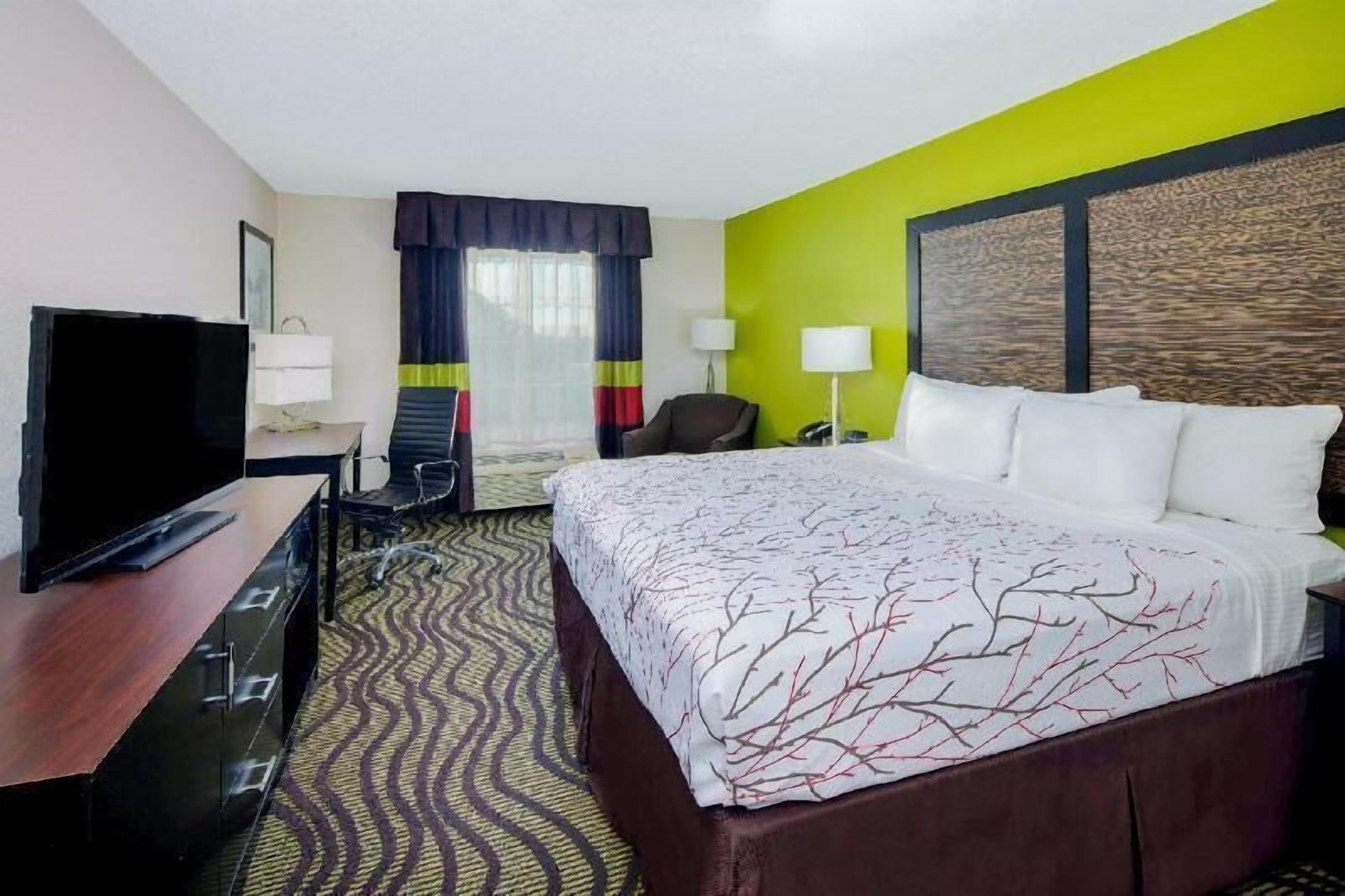 Premium bedding, pillow-top beds, desk, laptop workspace