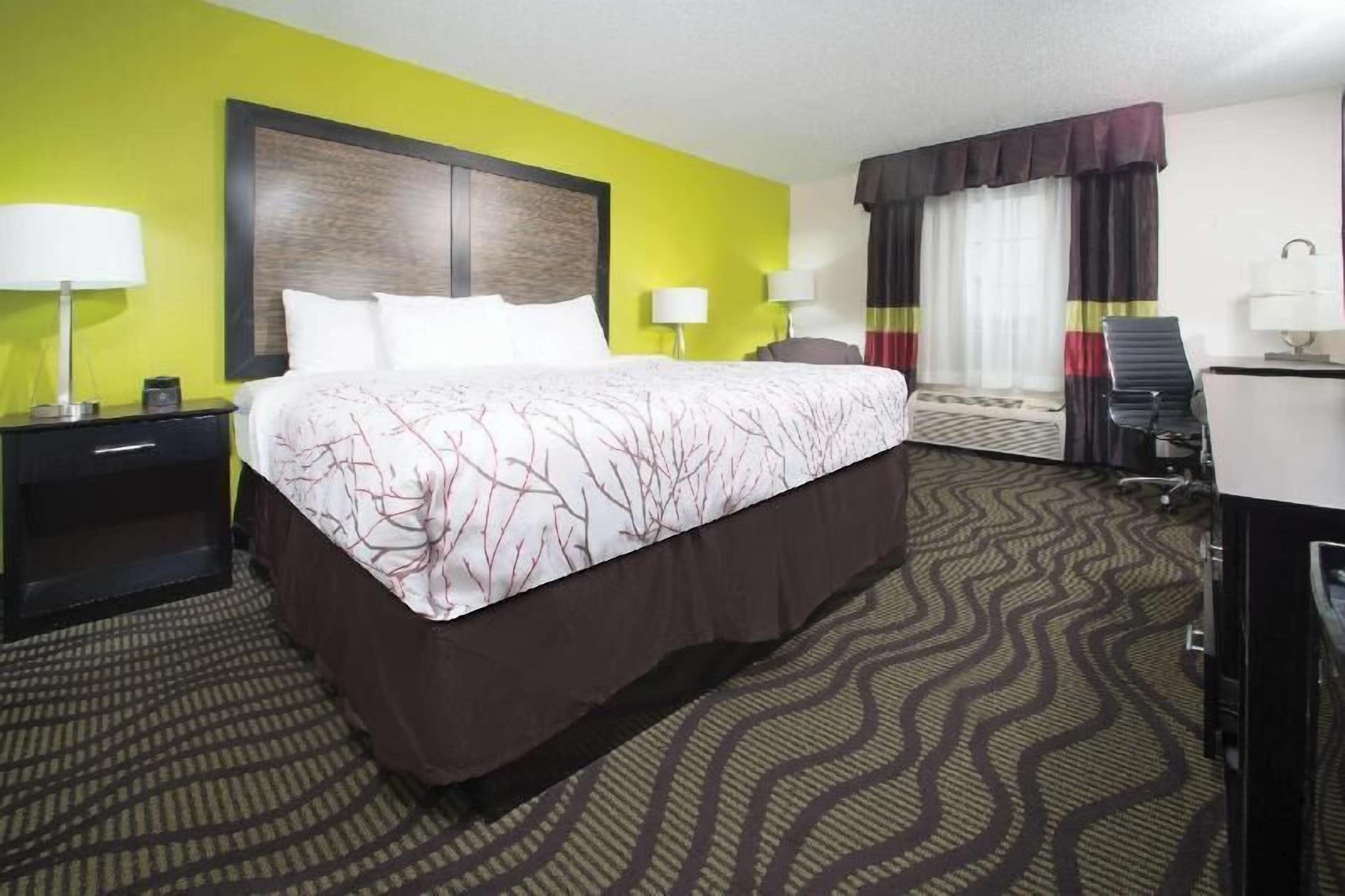 Premium bedding, pillow-top beds, desk, laptop workspace