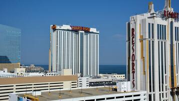 A high-rise hotel with a prominent "HARD ROCK" sign and a "RESORTS" sign on the side.