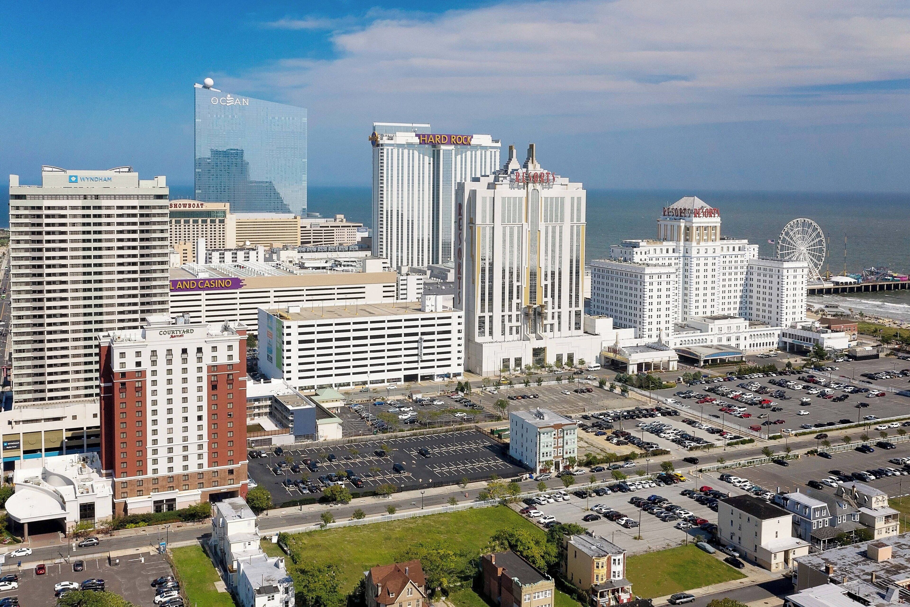 A cityscape with prominent buildings including a casino and a hotel.