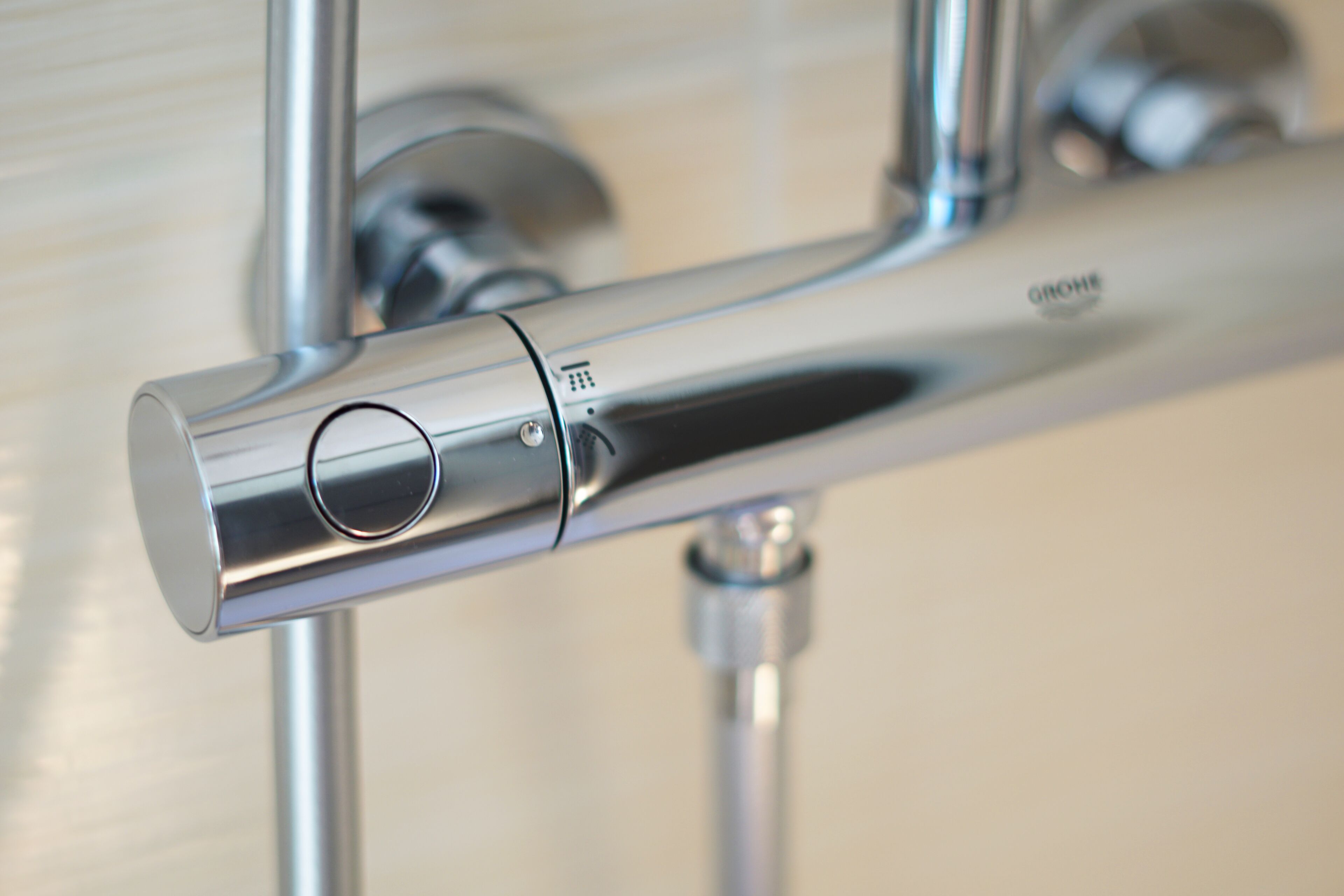 A chrome faucet with a single lever and a visible brand name.