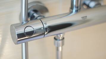 A chrome faucet with a single lever and a visible brand name.