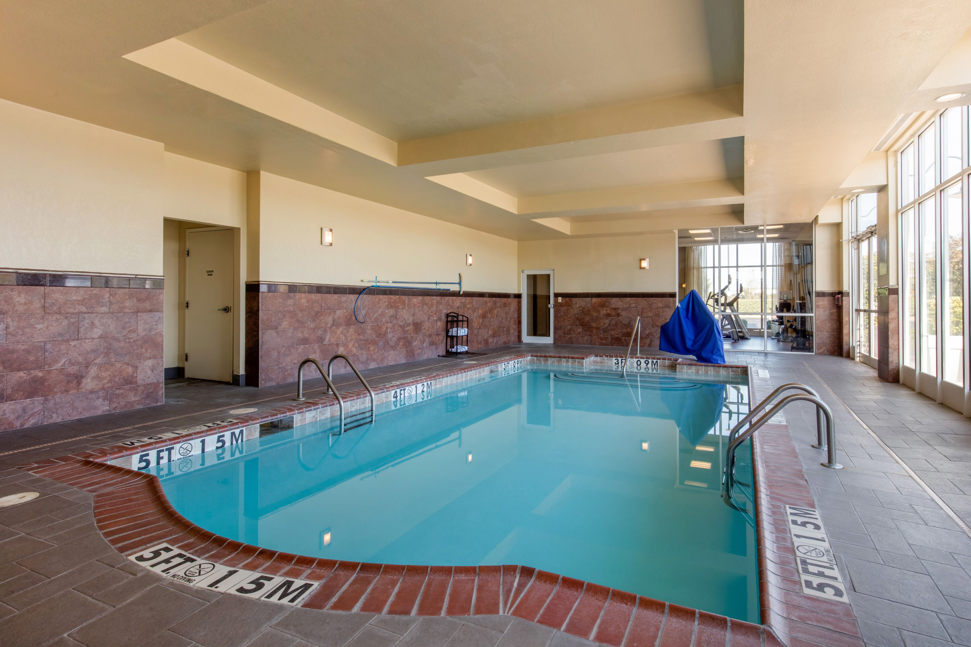 Indoor pool, open 7:00 AM to 10 PM, pool loungers
