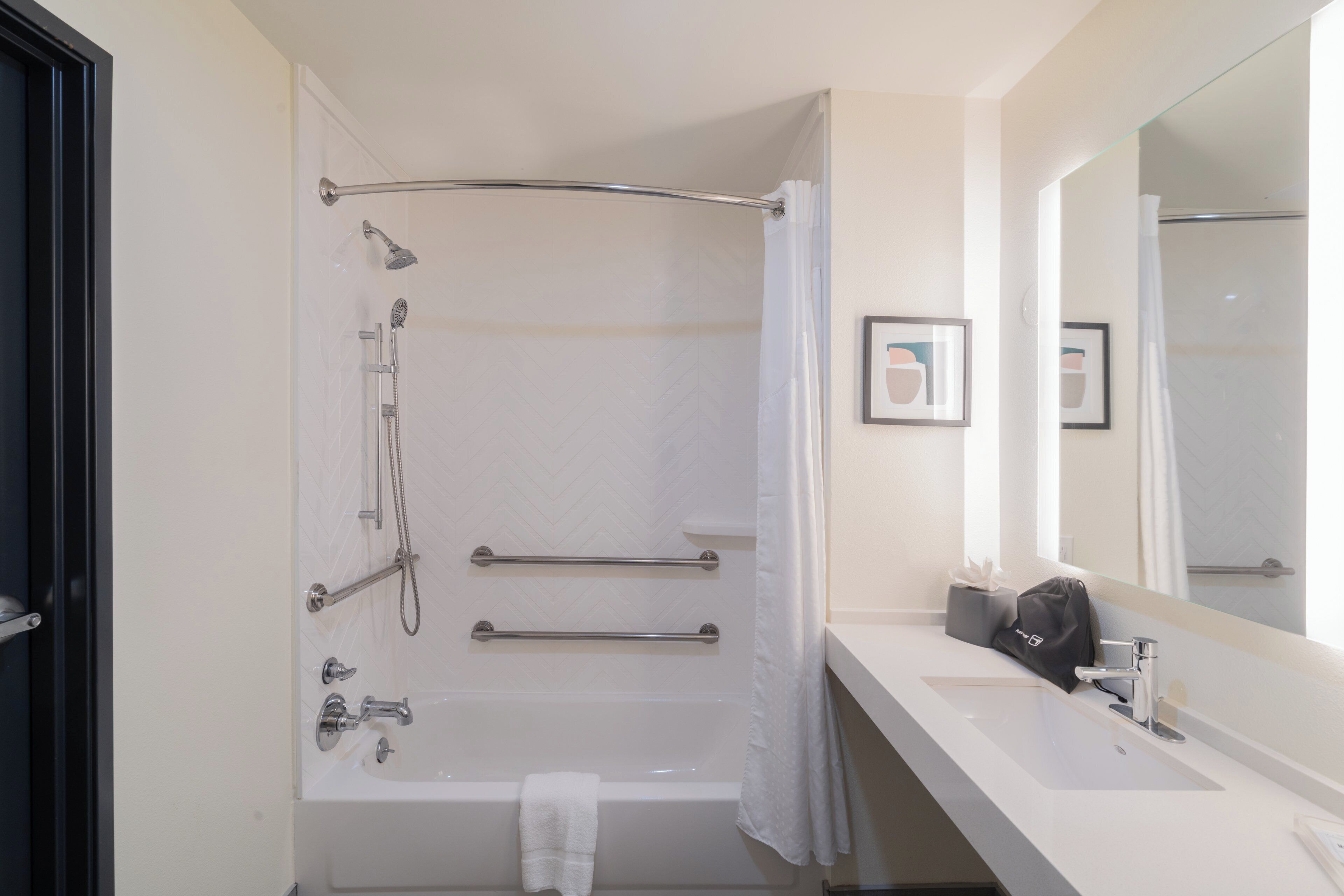 combined shower/bathtub, hair dryer, towels, soap