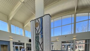 A spacious lobby with a central reception desk, large windows, and a tiled floor. - Comfort Inn & Suites Miami - Route 66 (Miami)