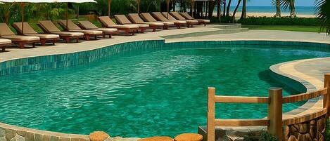 2 outdoor pools, pool umbrellas, pool loungers