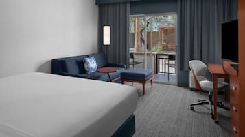 Hypo-allergenic bedding, desk, laptop workspace, blackout curtains