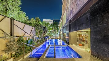 Outdoor pool, open 7:00 AM to 10:00 PM, pool loungers