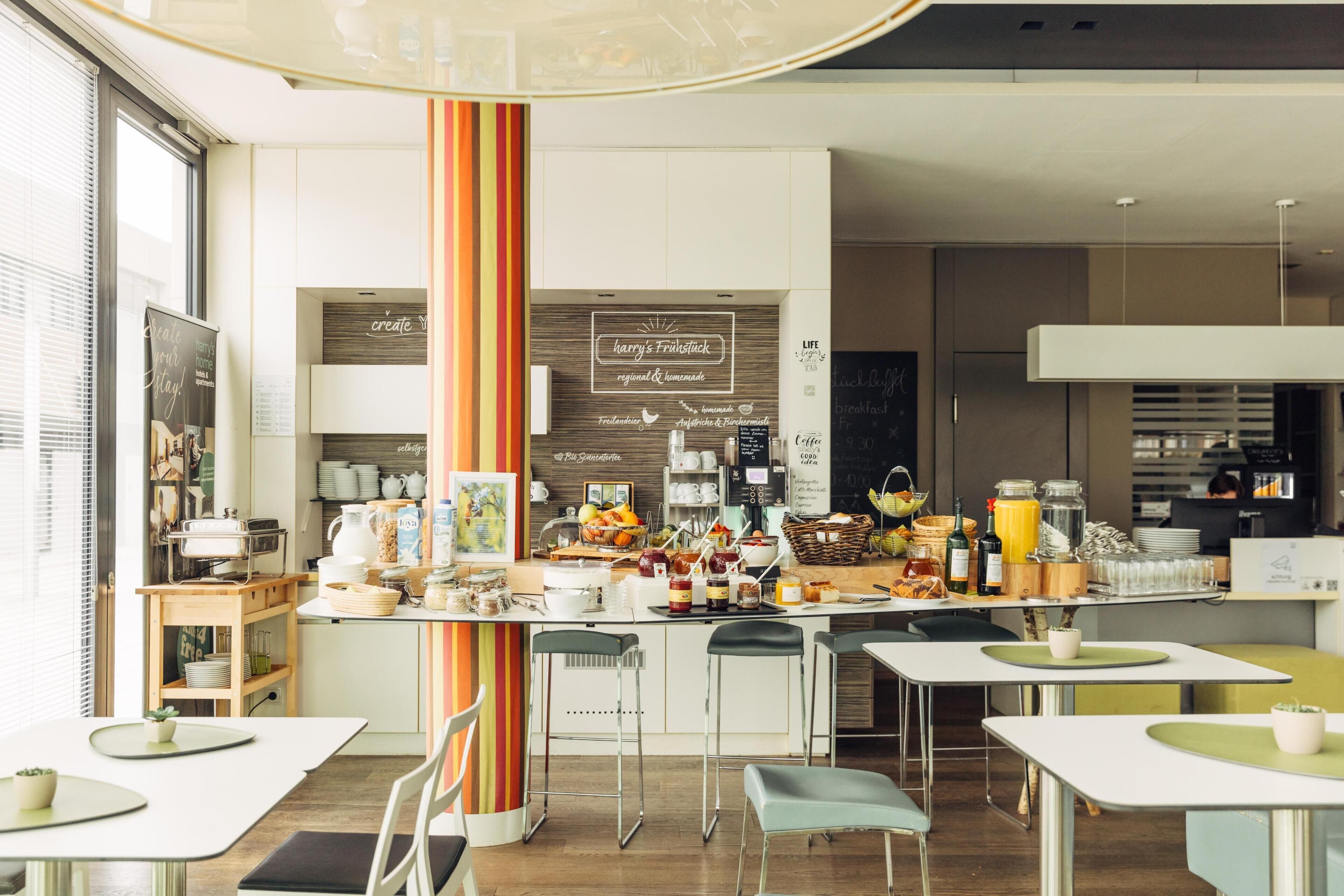 A modern cafe with a central bar area, multiple seating options, and a chalkboard menu.