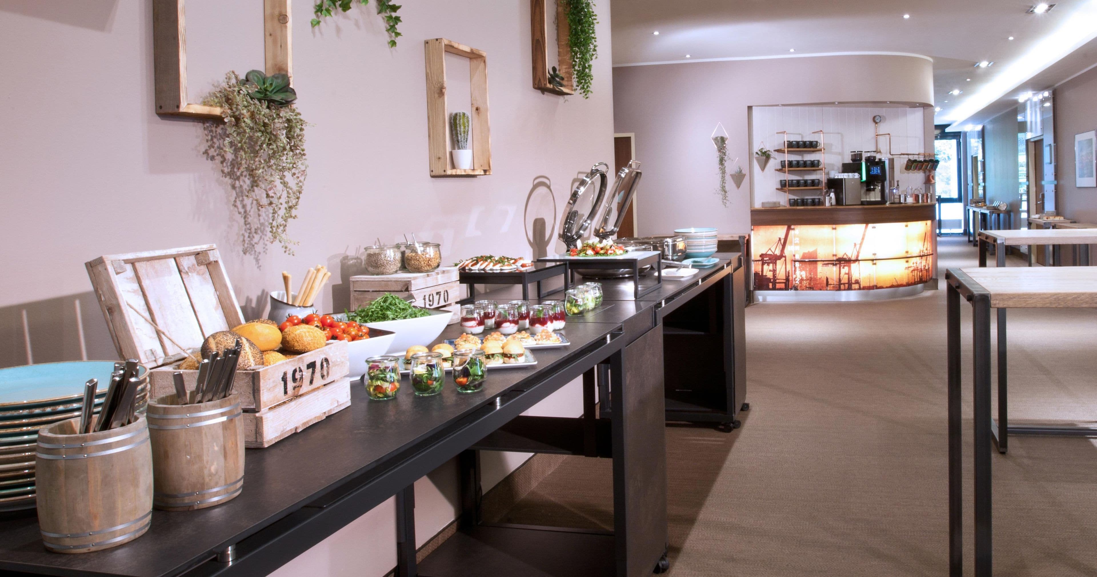 A buffet setup with various food items and utensils.