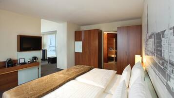 Hypo-allergenic bedding, in-room safe, laptop workspace