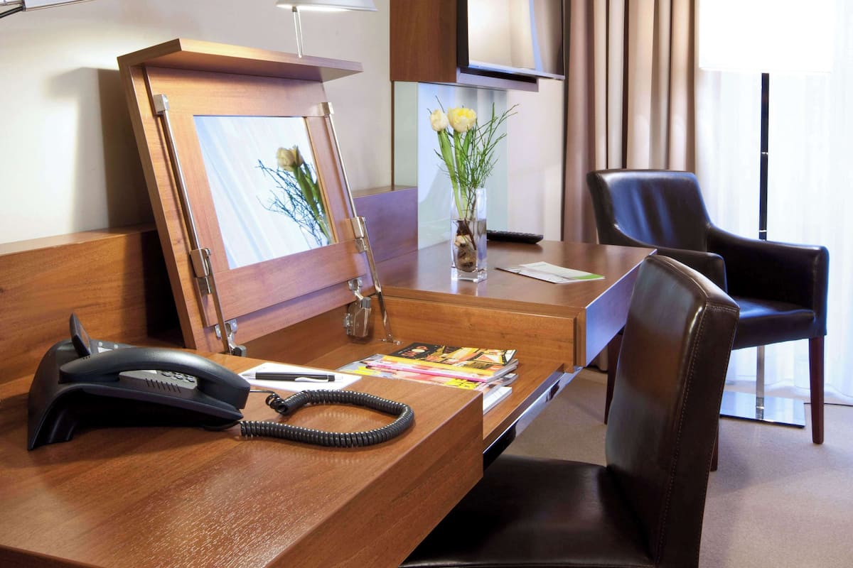 Enjoy a comfortable stay with a desk, chair, and large window offering a view of the outside.
