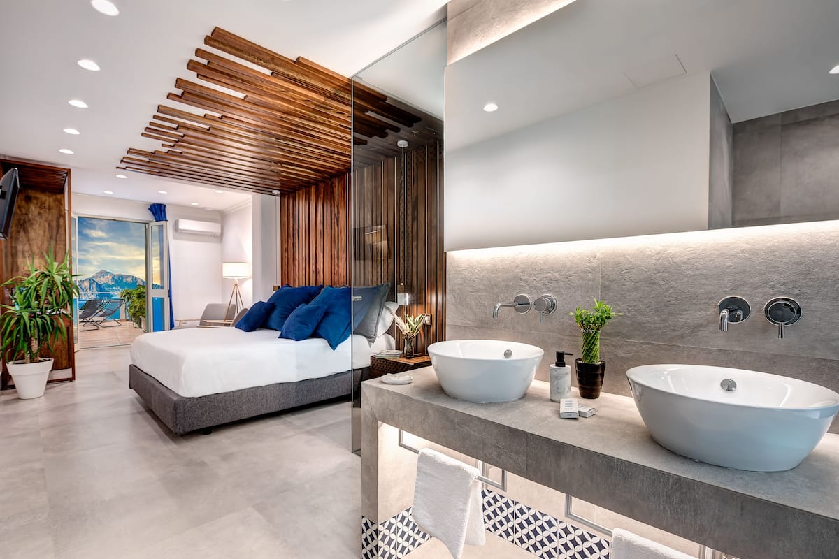 junior suite, 1 king bed, bathtub, sea view | 1 bedroom, premium bedding, down duvets, in-room safe