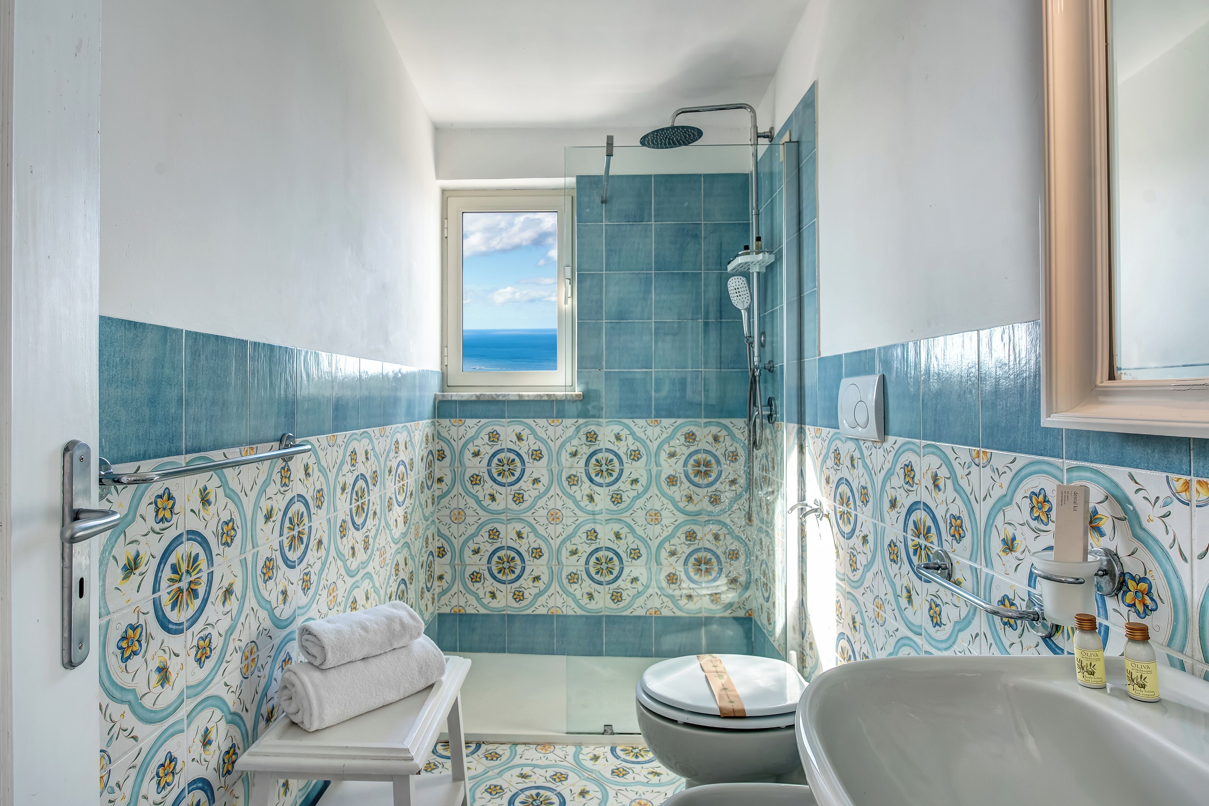 A bathroom with a shower, toilet, and bathtub.