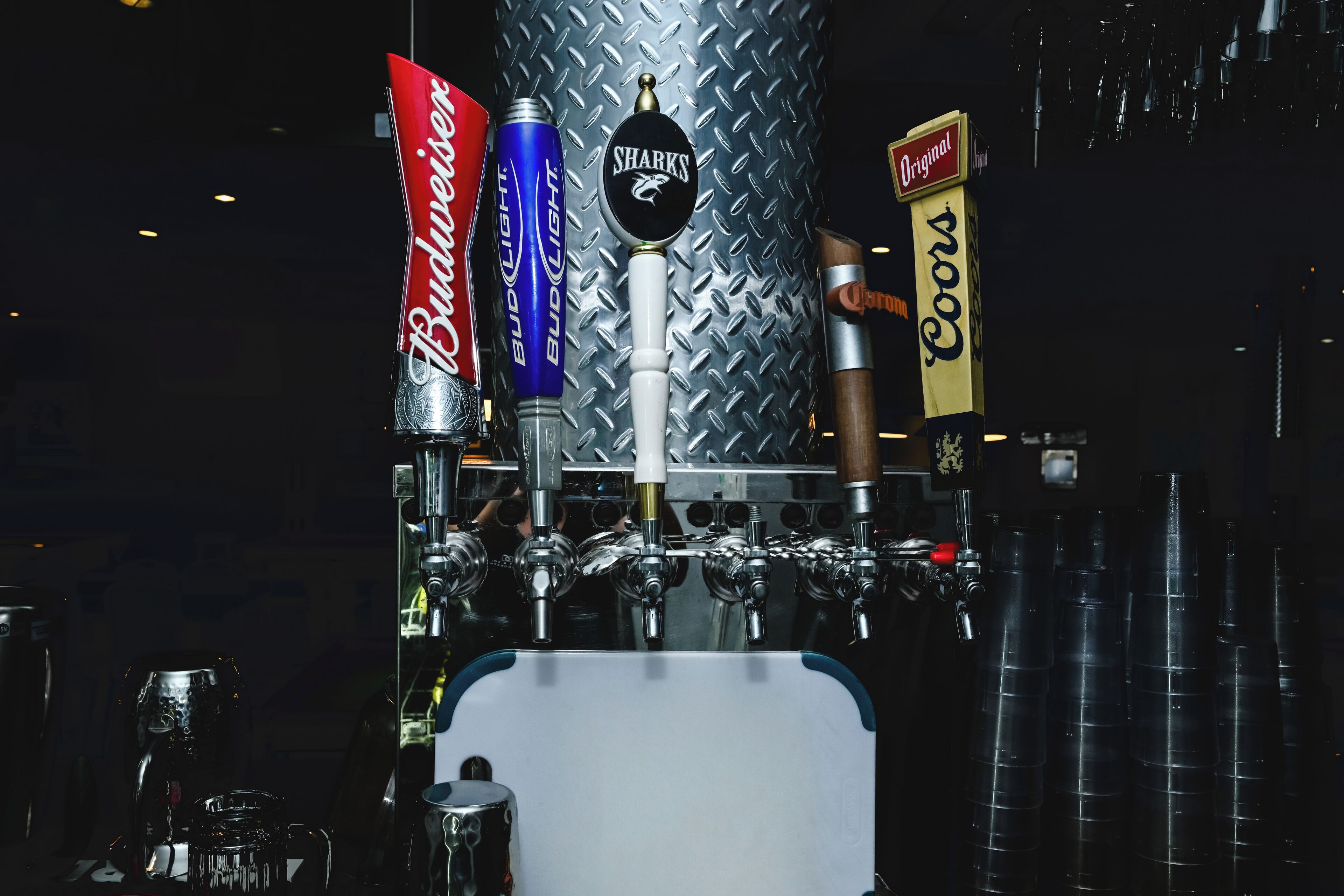 A beer tap system with multiple brands including Budweiser, Bud Light, and Coors.