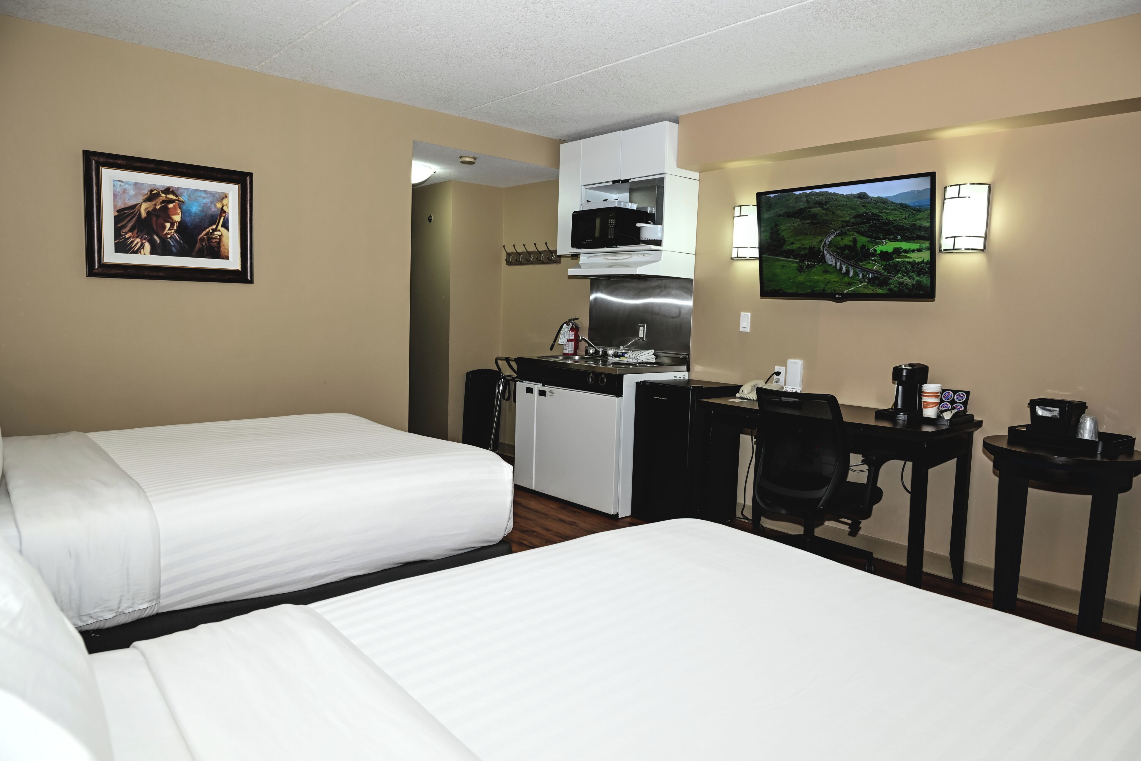 Premium bedding, desk, laptop workspace, iron/ironing board