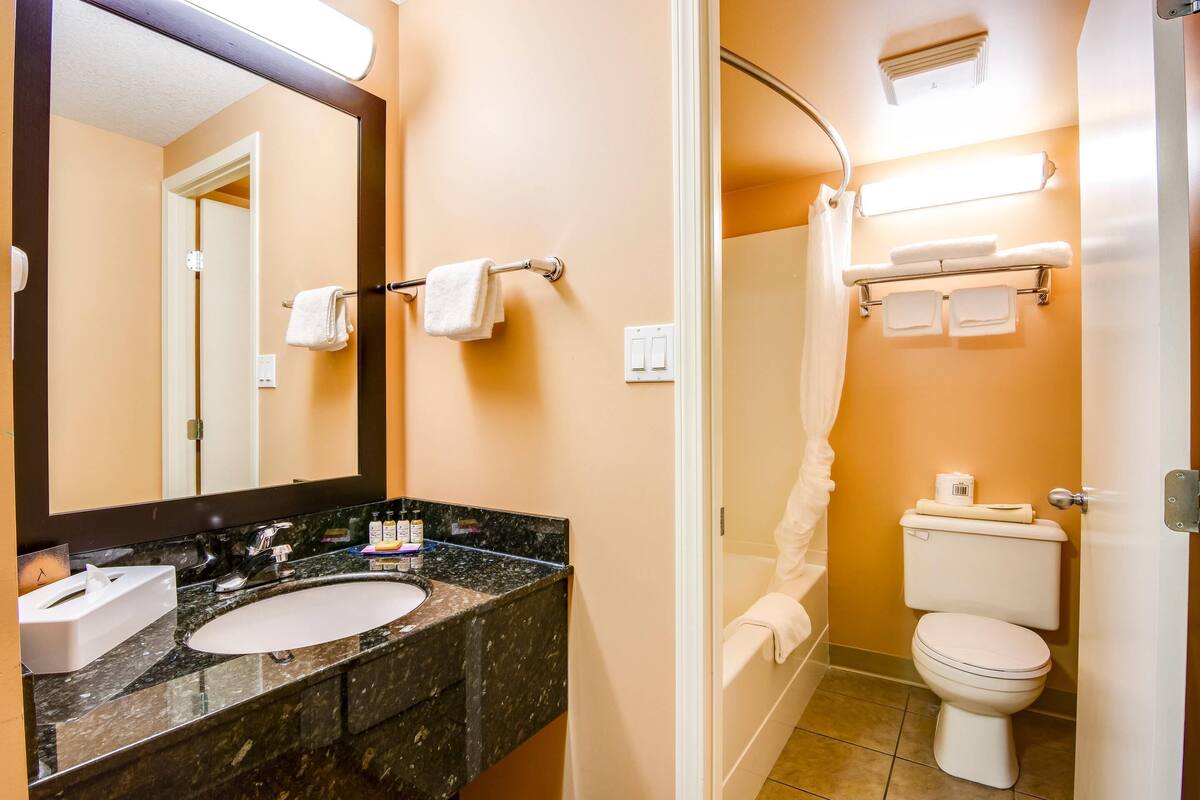 premium bedding, desk, laptop workspace, iron/ironing board