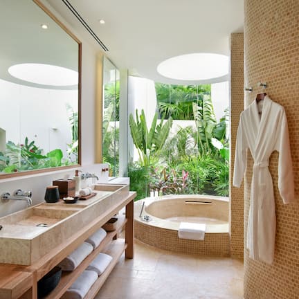 Separate tub and shower, rainfall showerhead, designer toiletries