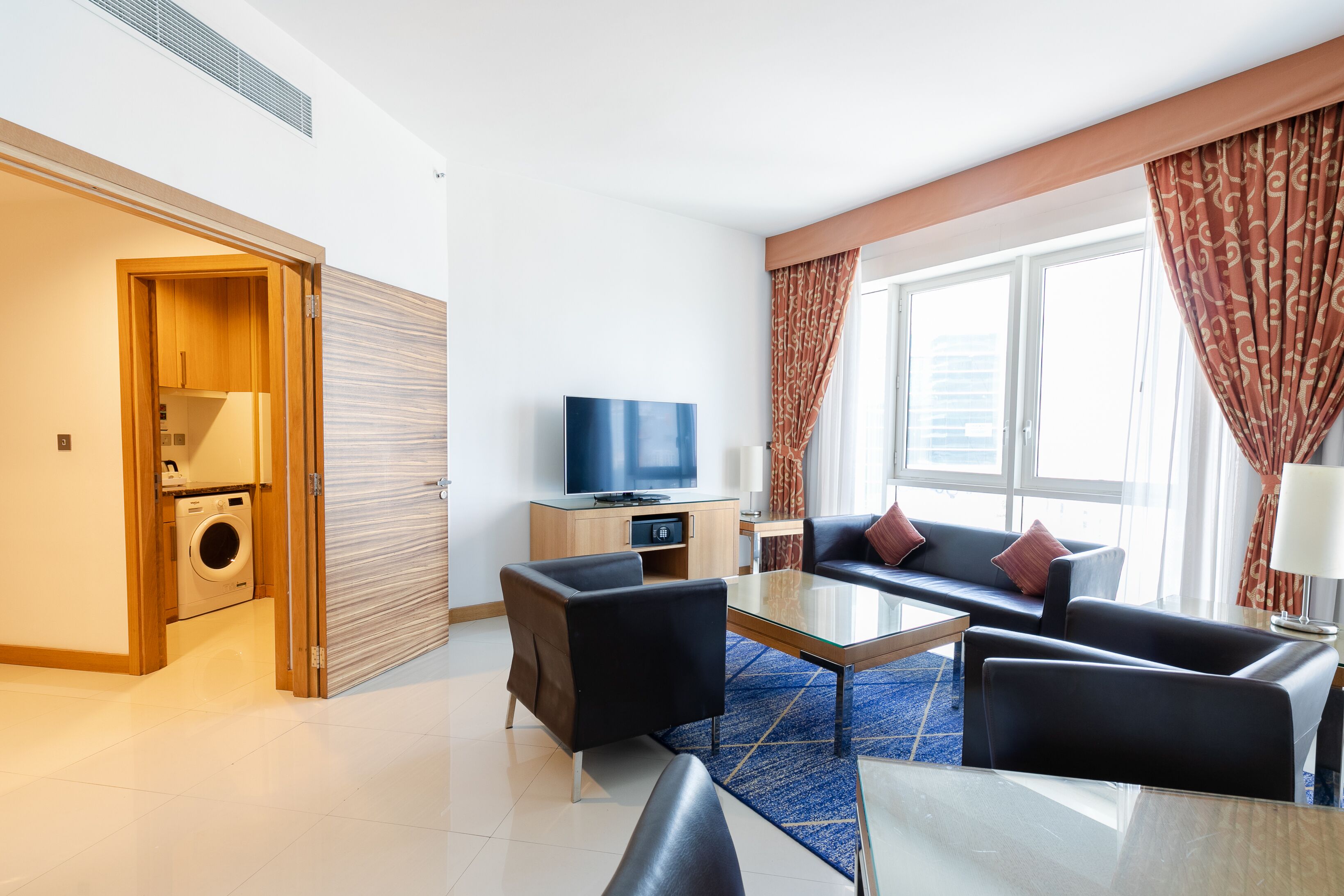 suite, 1 bedroom, non smoking - complimentary shuttle service to dubai mall and kite beach | living area | 32-inch lcd tv with satellite channels, tv
