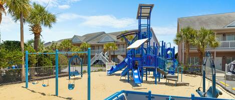 A playground with swings, slides, and climbing structures.