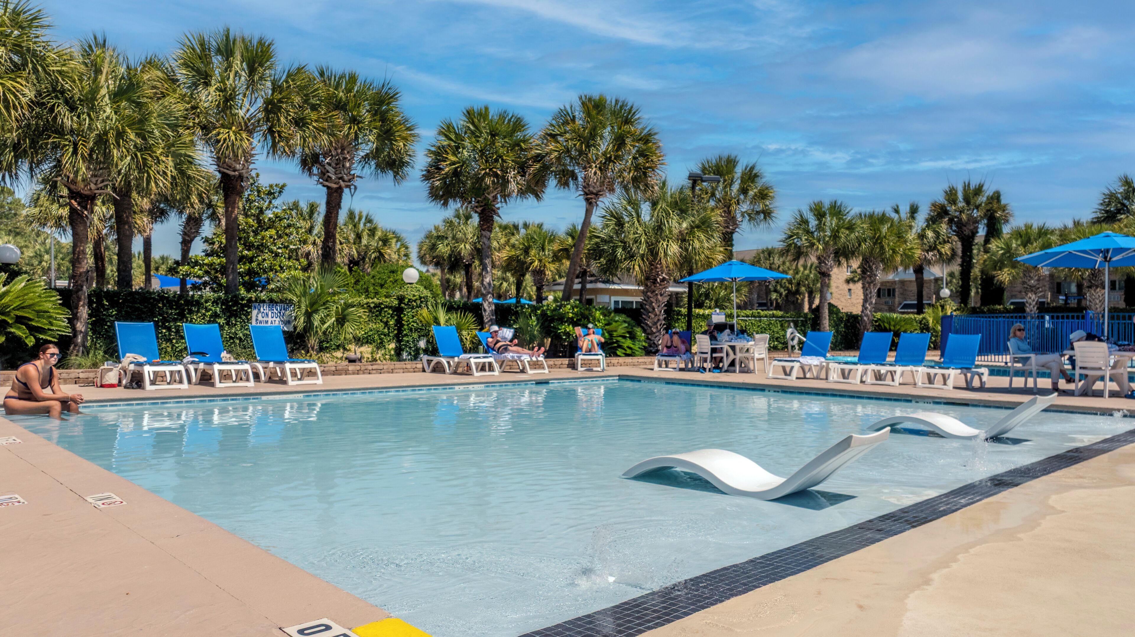 Indoor pool, outdoor pool, pool umbrellas, pool loungers
