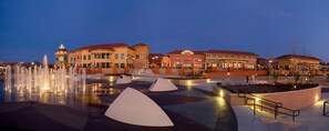 A hotel with a fountain, a restaurant, and a bell tower. - Hilton Dallas/Rockwall Lakefront (Rockwall)