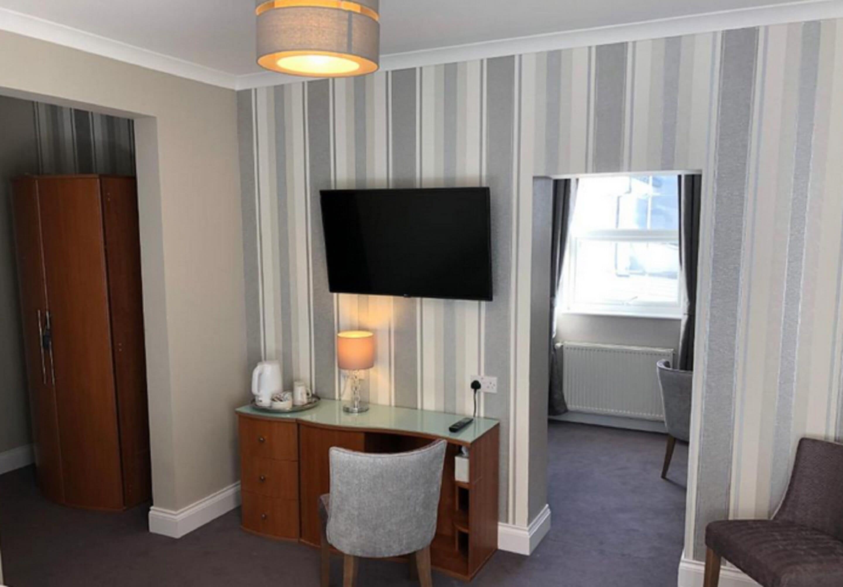 family room | desk, iron/ironing board, bed sheets