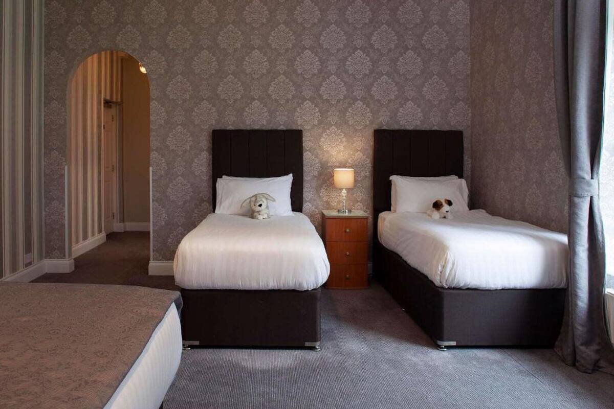 family room | desk, iron/ironing board, bed sheets