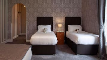 Family Room | Desk, iron/ironing board, bed sheets