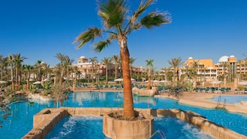 Indoor pool, outdoor pool, pool umbrellas, pool loungers