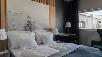Hypo-allergenic bedding available, down comforters, minibar