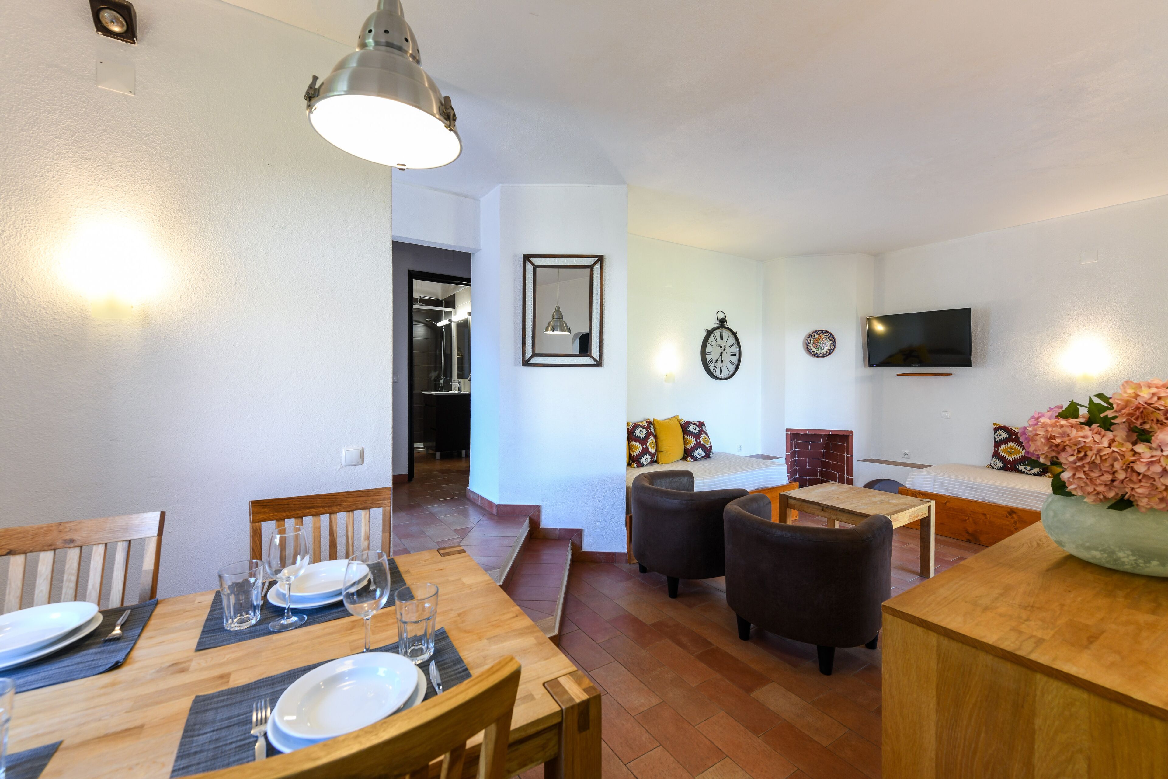 A modern interior with a dining area, a living space, and a kitchen.