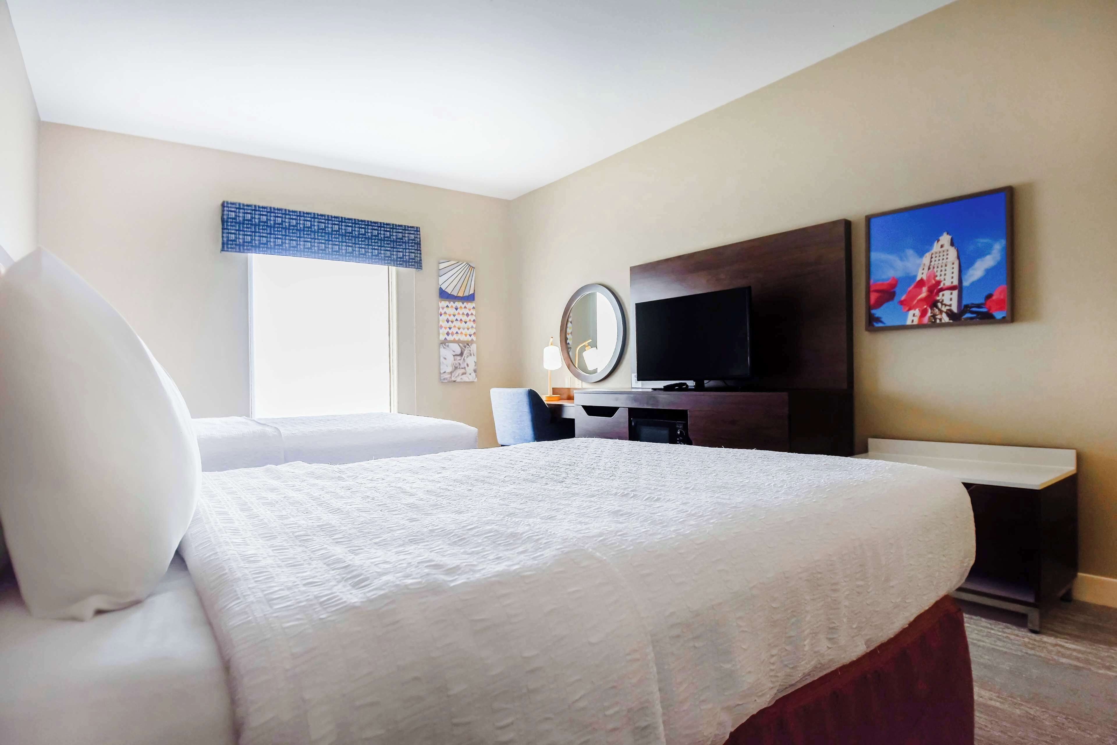standard room with two queen beds | in-room safe, desk, blackout curtains, iron/ironing board