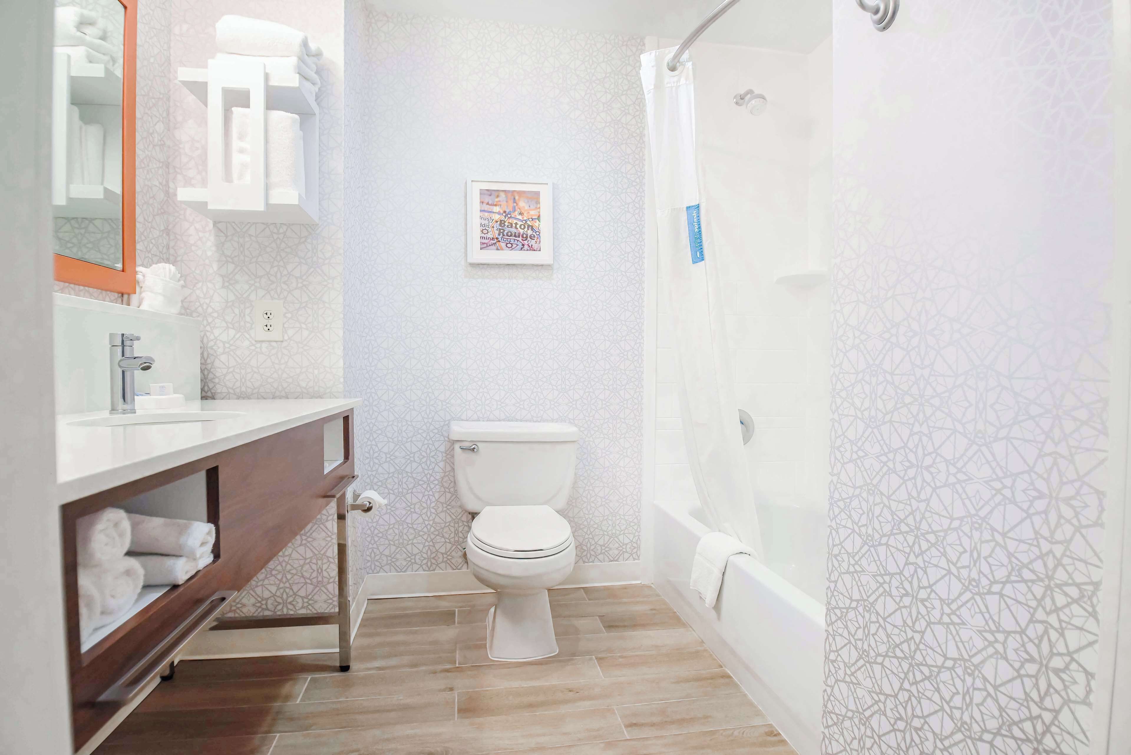 standard room with two queen beds | bathroom | free toiletries, hair dryer, towels