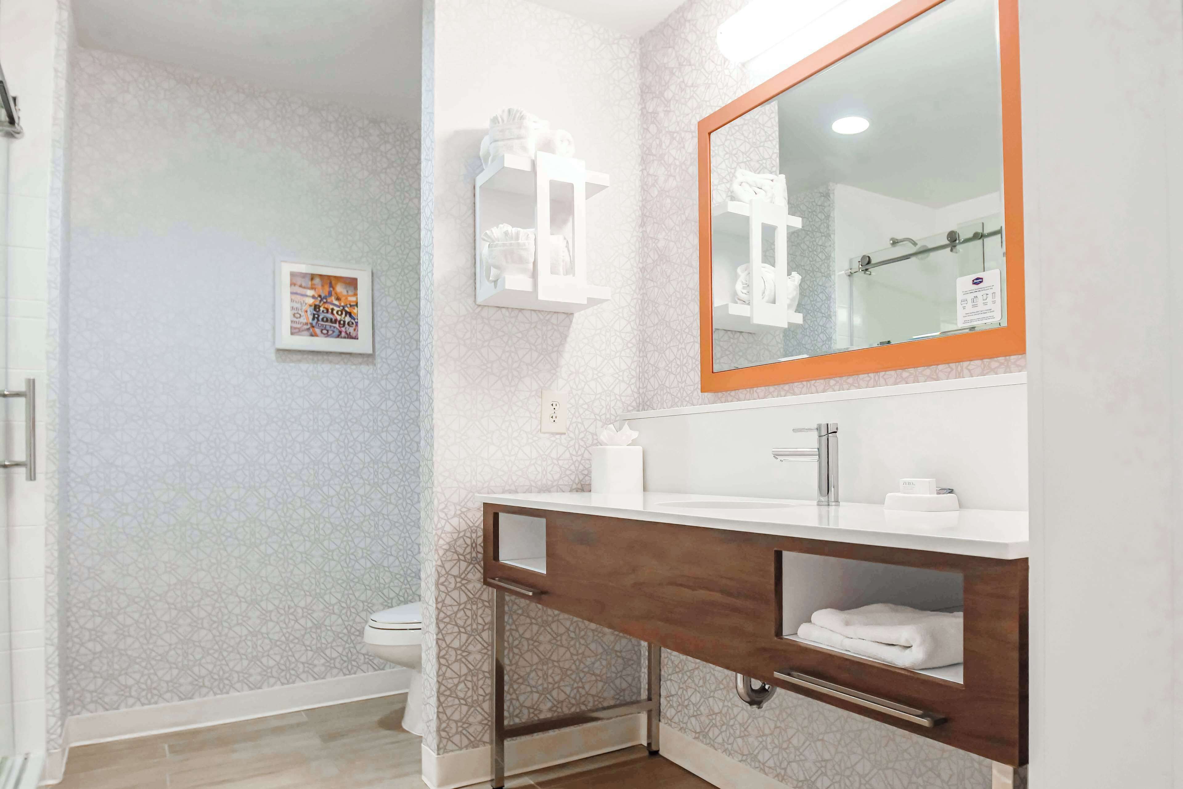 standard room with king bed | bathroom | free toiletries, hair dryer, towels