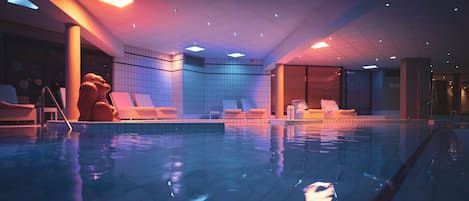 Indoor pool, open 9:00 AM to 11:00 PM, pool umbrellas, pool loungers