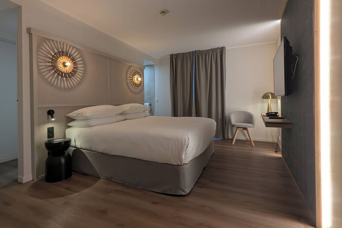 Luxe beddengoed, een kluis op de kamer, een strijkplank/strijkijzer