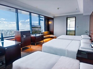 A hotel room with a large window, a desk, a sofa, and two beds. - Renaissance Shanghai Zhongshan Park Skyline Hotel (Shanghai)